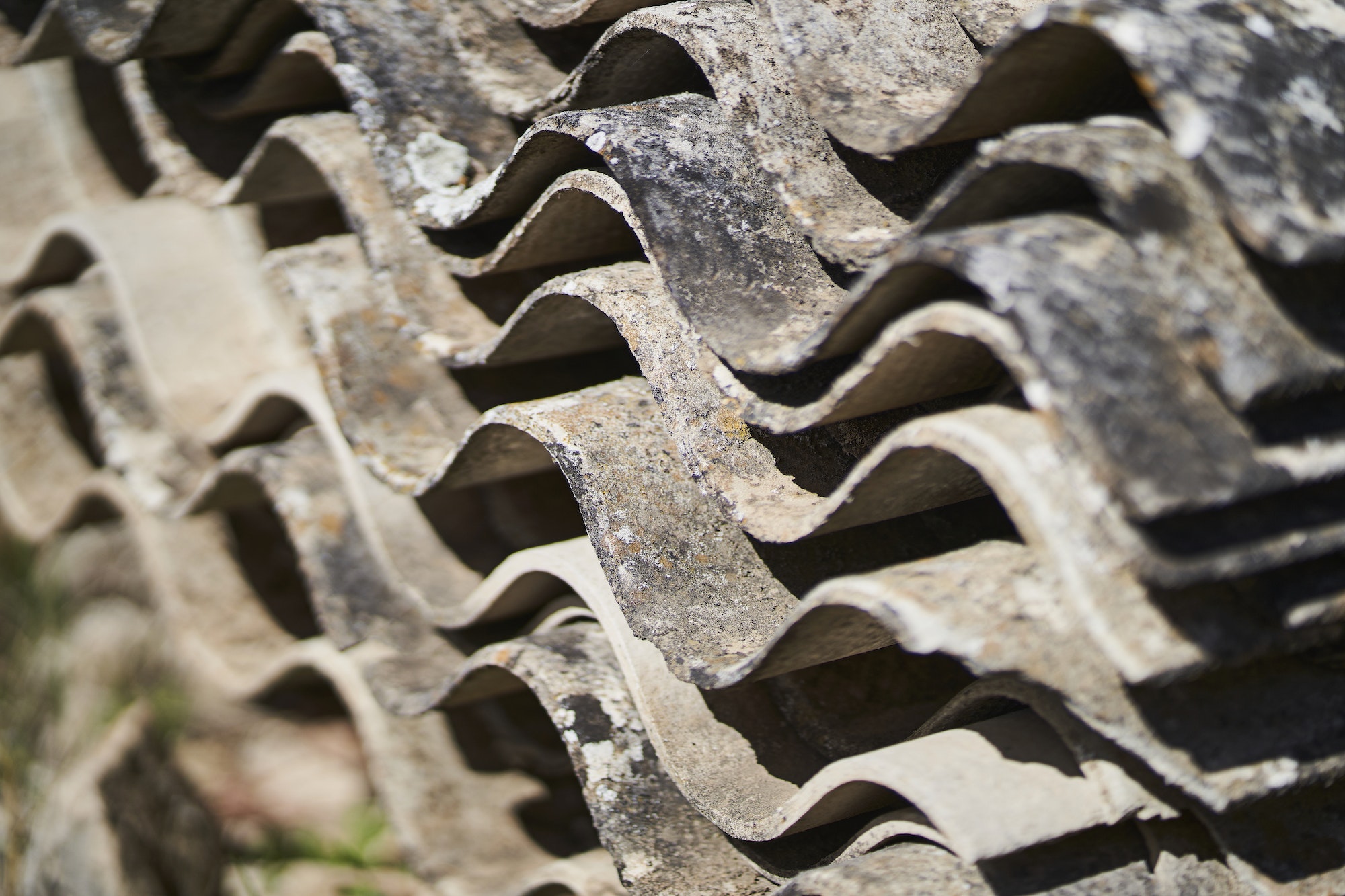 toxic waste with asbestos from piled-up asbestos sheets